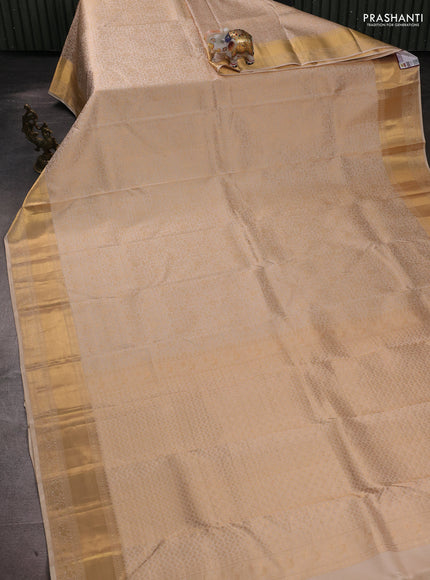 Pure kanchipuram silk saree cream with allover zari woven brocade weaves and rich zari woven border