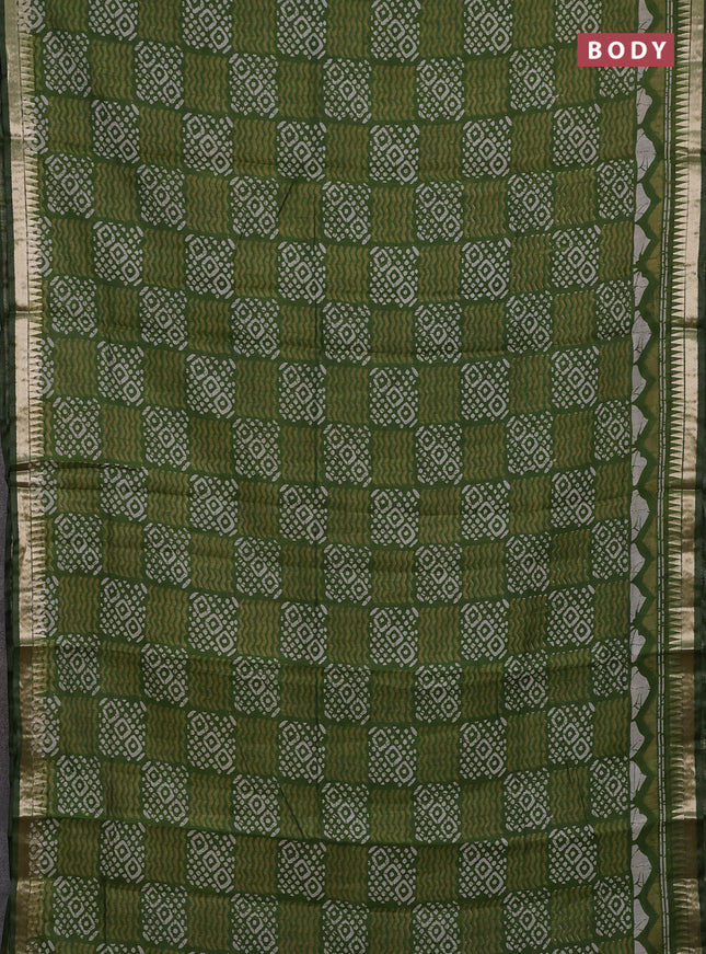 Semi maheshwari cotton saree sap green with allover batik prints and zari woven border