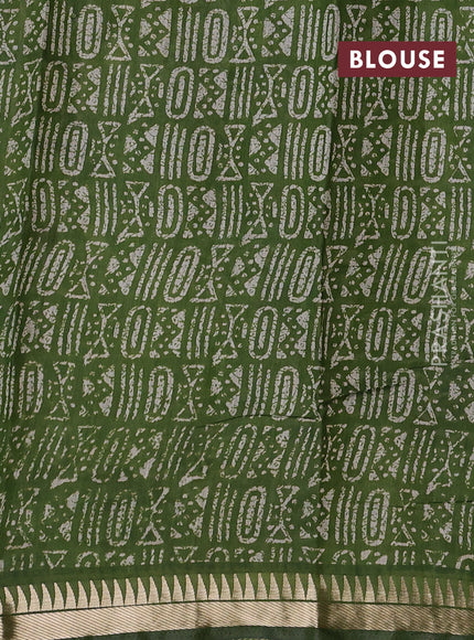 Semi maheshwari cotton saree sap green with allover batik prints and zari woven border