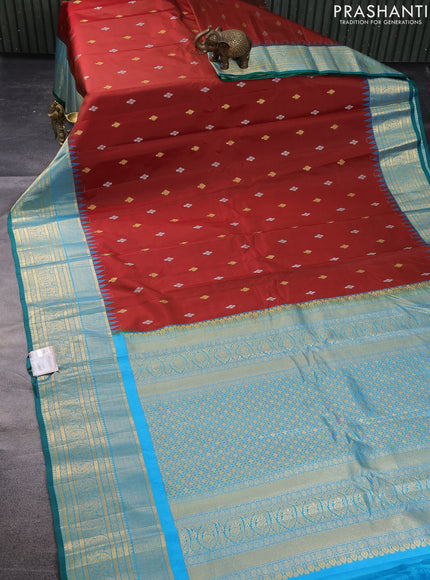 Pure gadwal silk saree maroon and cs blue with zari woven buttas and temple design zari woven border