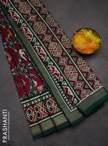 Semi pochampally saree wine shade and dark green with allover patola prints and zari woven border