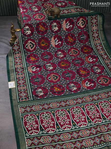 Semi pochampally saree wine shade and dark green with allover patola prints and zari woven border