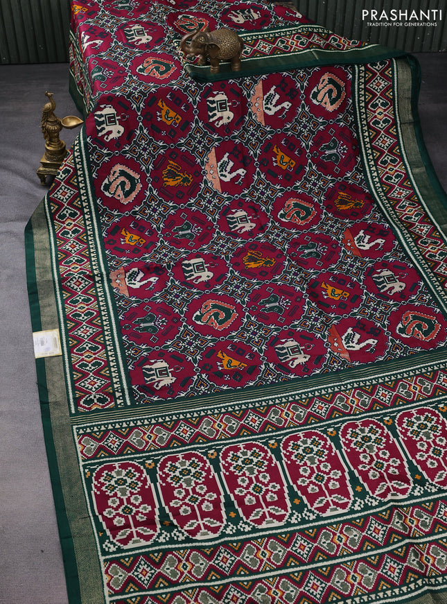 Semi pochampally saree wine shade and dark green with allover patola prints and zari woven border