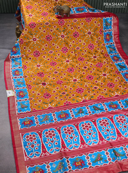Semi pochampally saree mustard yellow and pink with allover patola prints and zari woven border