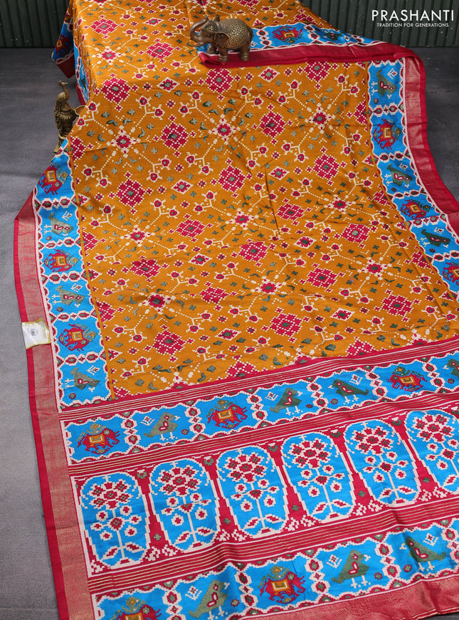 Semi pochampally saree mustard yellow and pink with allover patola prints and zari woven border