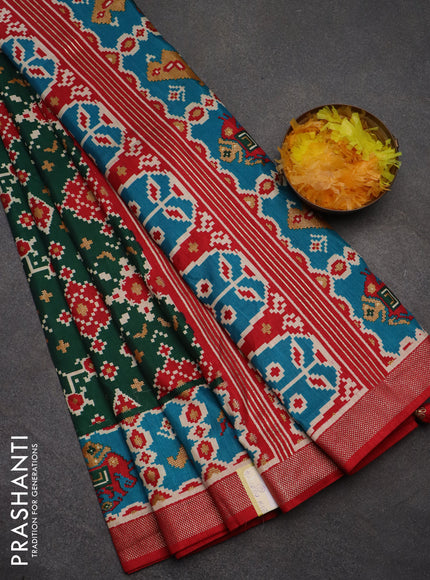 Semi pochampally saree green and red with allover patola prints and zari woven border