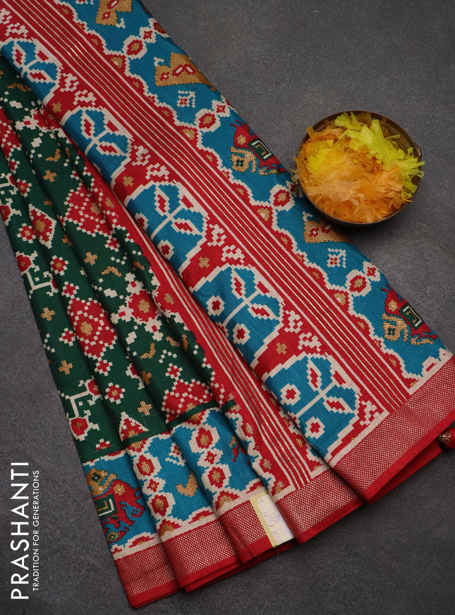 Semi pochampally saree green and red with allover patola prints and zari woven border