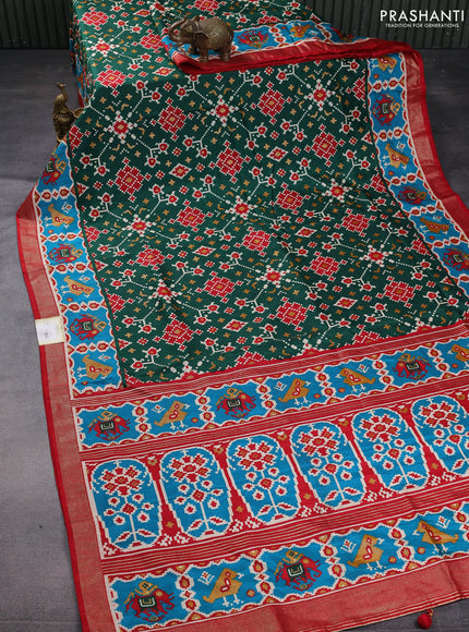 Semi pochampally saree green and red with allover patola prints and zari woven border