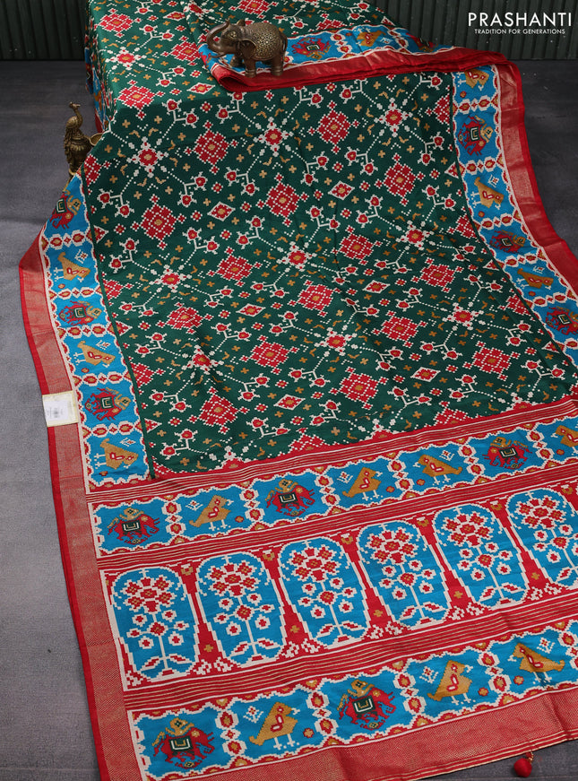 Semi pochampally saree green and red with allover patola prints and zari woven border