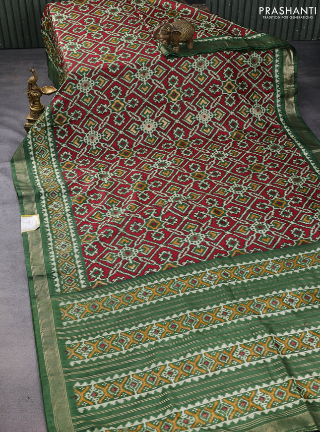 Semi pochampally saree green with allover ikat prints and zari woven border