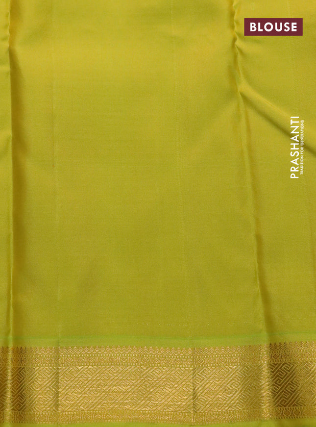 Pure kanchipuram silk saree green and lime green with woven zari buttas and temple design zari woven border