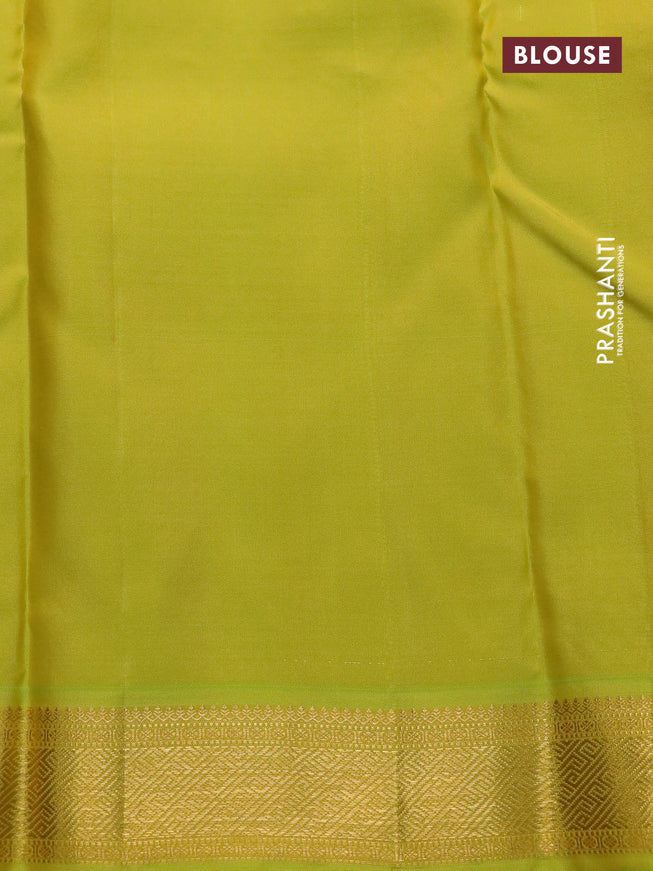 Pure kanchipuram silk saree green and lime green with woven zari buttas and temple design zari woven border