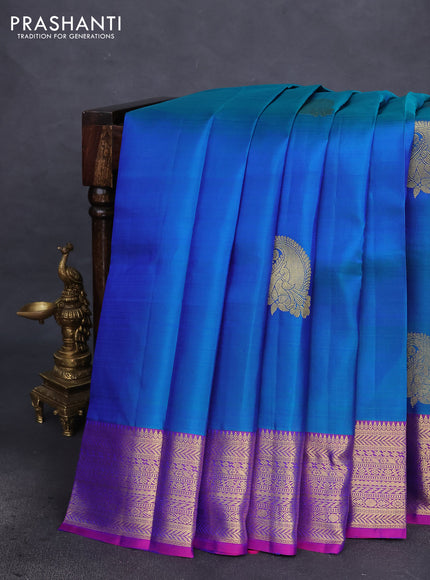 Pure kanchipuram silk saree dual shade of bluish green and dual shade of purple with woven zari buttas and zari woven border