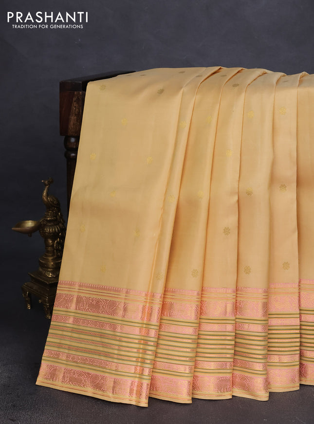 Pure kanchipuram silk saree cream with zari woven buttas and long zari woven border
