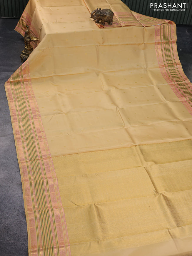 Pure kanchipuram silk saree cream with zari woven buttas and long zari woven border