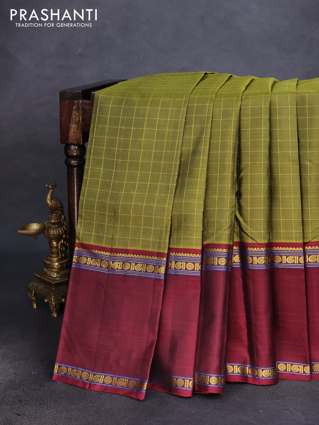 Pure kanchipuram silk saree mehendi green with allover zari checked pattern and ganga jamuna border