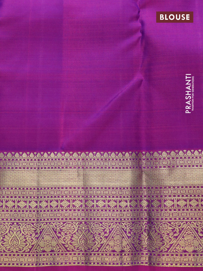 Pure kanchipuram silk saree dual shade of teal blue and dual shade of purple with allover zari checks & zari paisley buttas and zari woven border