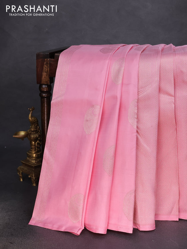 Pure kanchipuram silk saree peach pink and dark magenta pink with allover zari weaves & buttas in borderless style