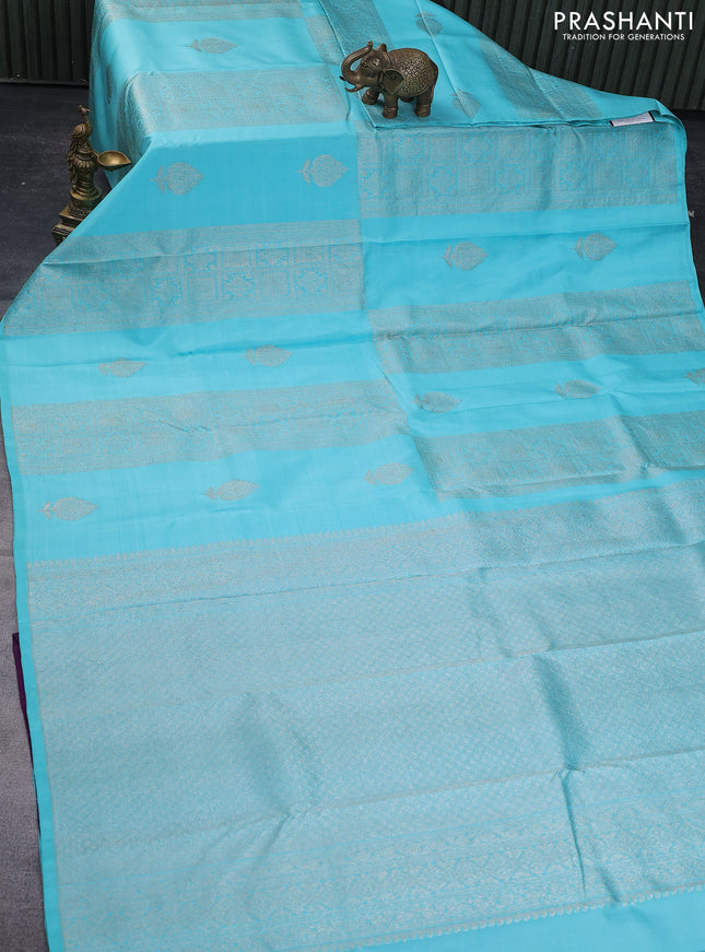 Pure kanchipuram silk saree teal blue shade and purple with allover zari weaves & buttas in borderless style
