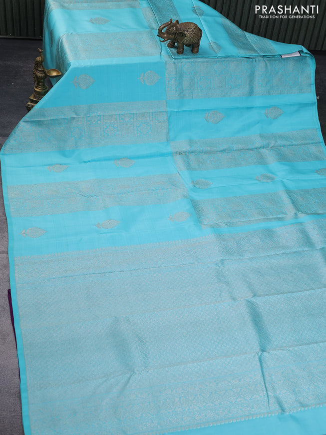 Pure kanchipuram silk saree teal blue shade and purple with allover zari weaves & buttas in borderless style