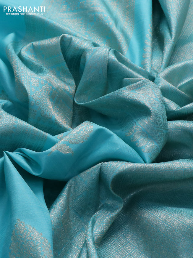 Pure kanchipuram silk saree teal blue shade and purple with allover zari weaves & buttas in borderless style