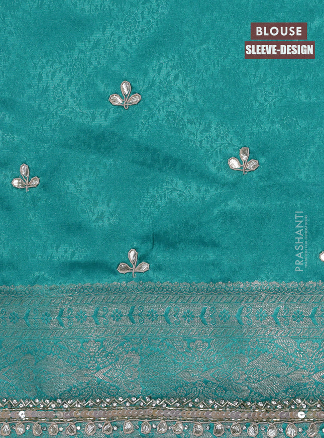 Banarasi silk saree teal blue with allover zari woven brocade weaves and embroidery sequin work border