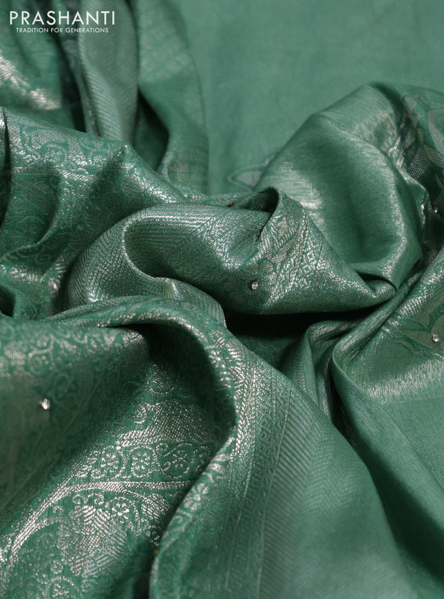 Banarasi silk saree pastel green with allover zari woven brocade weaves and embroidery mirror work border