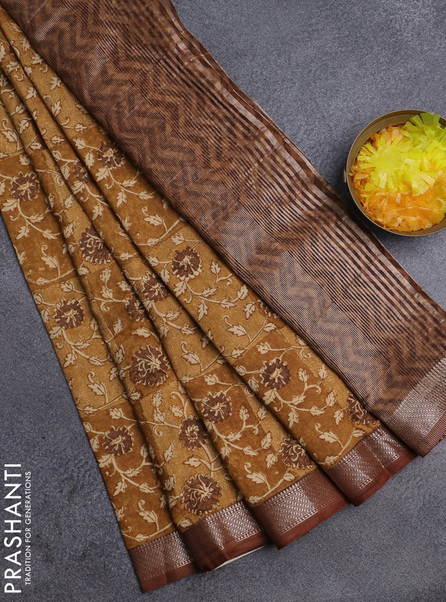 Semi chanderi saree mustard shade and brown with allover floral prints and zari woven border