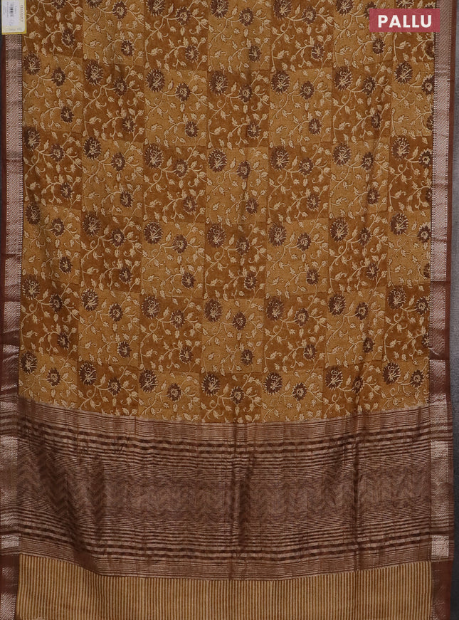 Semi chanderi saree mustard shade and brown with allover floral prints and zari woven border