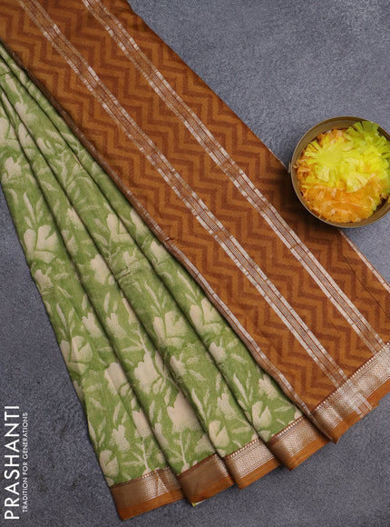 Semi chanderi saree light green and mustard shade with floral prints and zari woven border