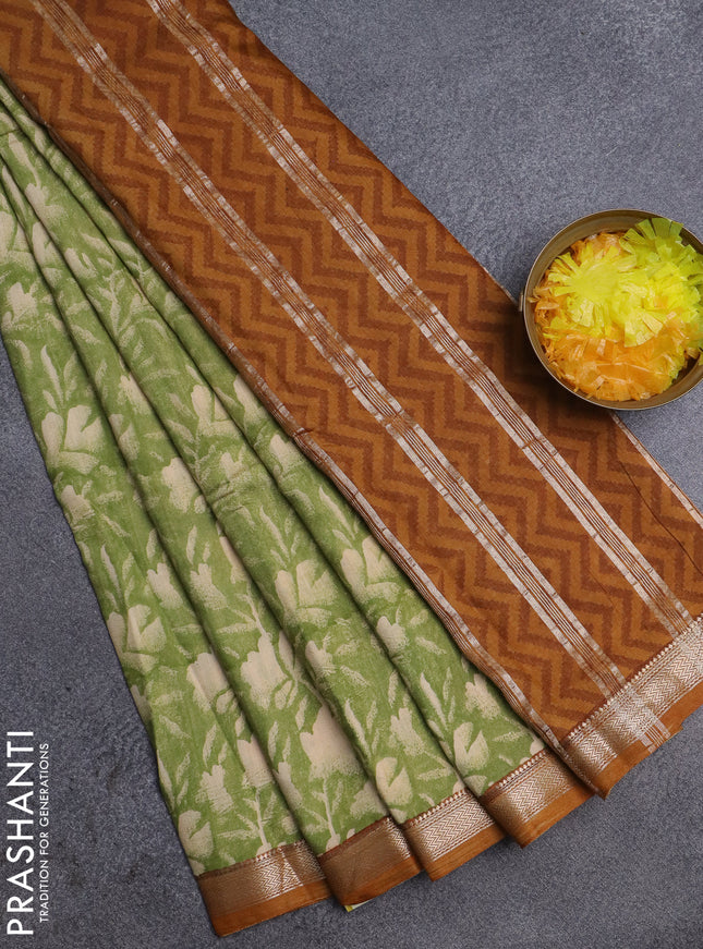 Semi chanderi saree light green and mustard shade with floral prints and zari woven border