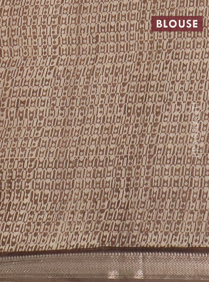 Semi chanderi saree sandal and brown shade with allover floral prints and zari woven border