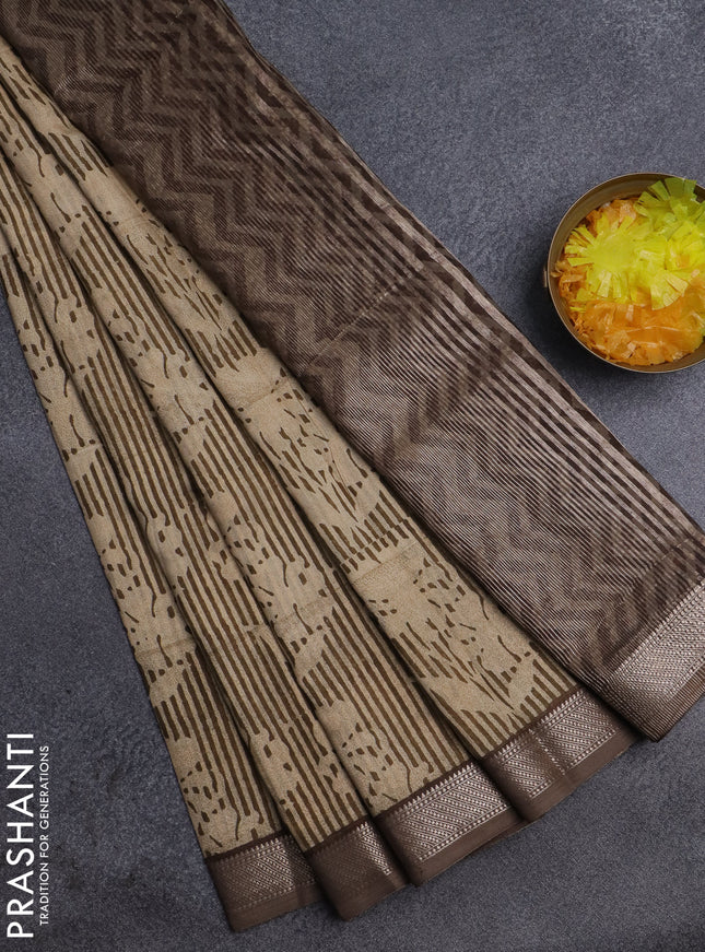 Semi chanderi saree sandal and pastel brown with allover floral prints and zari woven border