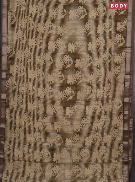 Semi chanderi saree sandal and pastel brown with allover floral prints and zari woven border