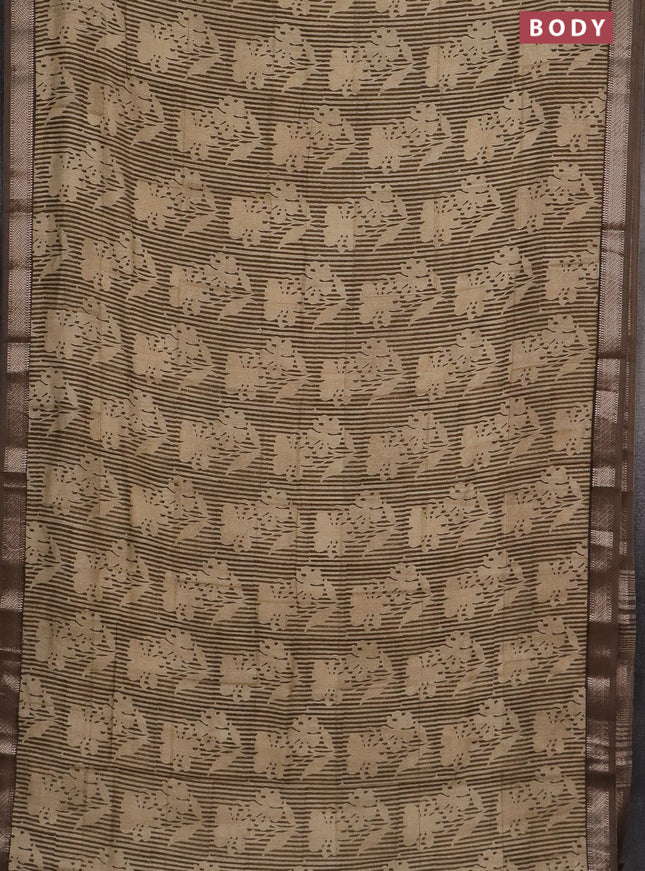 Semi chanderi saree sandal and pastel brown with allover floral prints and zari woven border