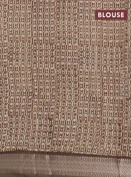 Semi chanderi saree sandal and pastel brown with allover floral prints and zari woven border