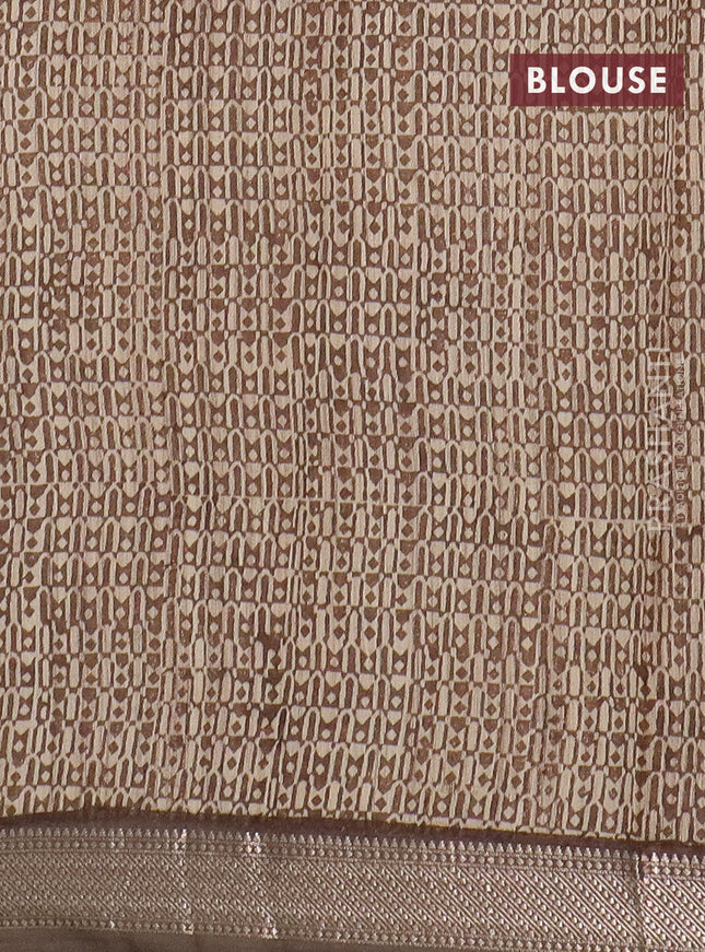 Semi chanderi saree sandal and pastel brown with allover floral prints and zari woven border