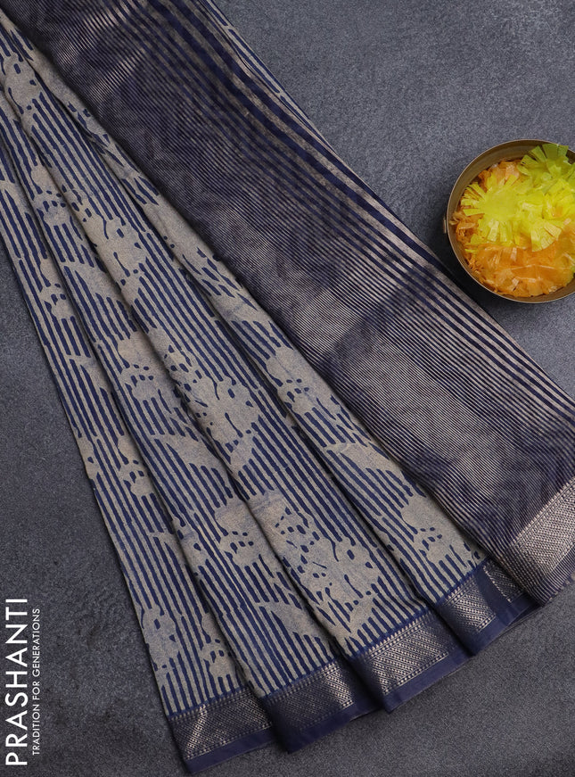 Semi chanderi saree beige and blue with allover floral prints and zari woven border