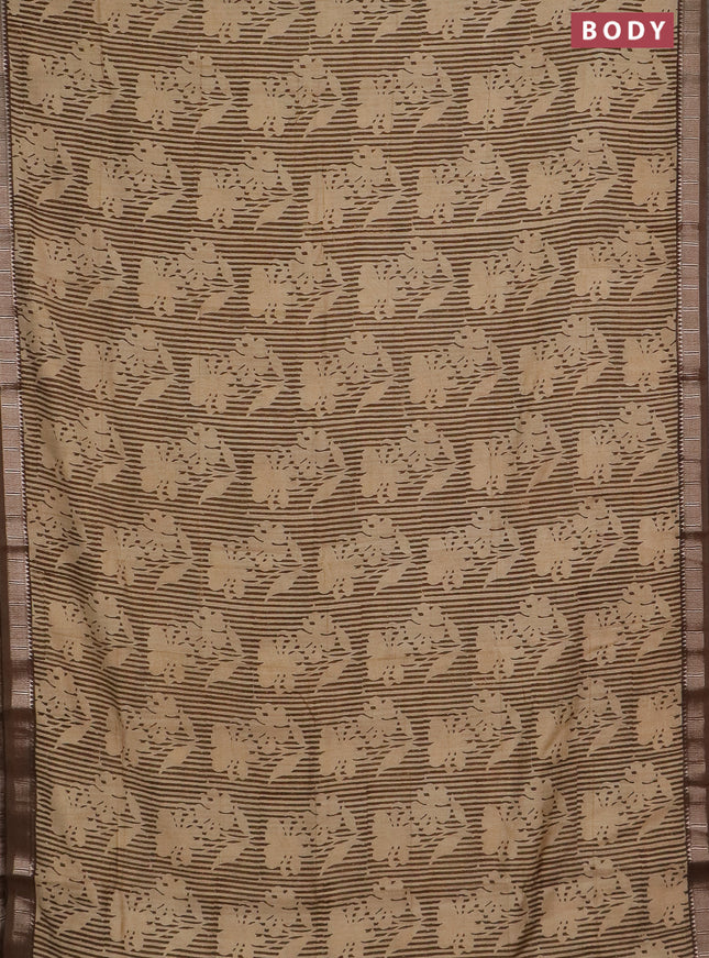 Semi chanderi saree sandal and pastel brown with allover floral prints and zari woven border