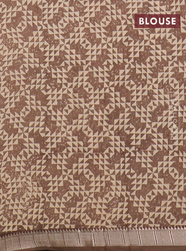 Semi chanderi saree sandal and pastel brown with allover floral prints and zari woven border