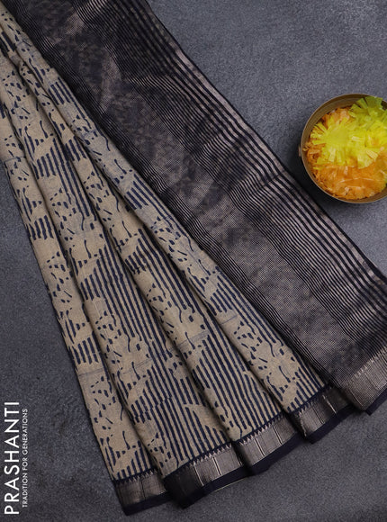 Semi chanderi saree sandal and dark blue with allover floral prints and zari woven border