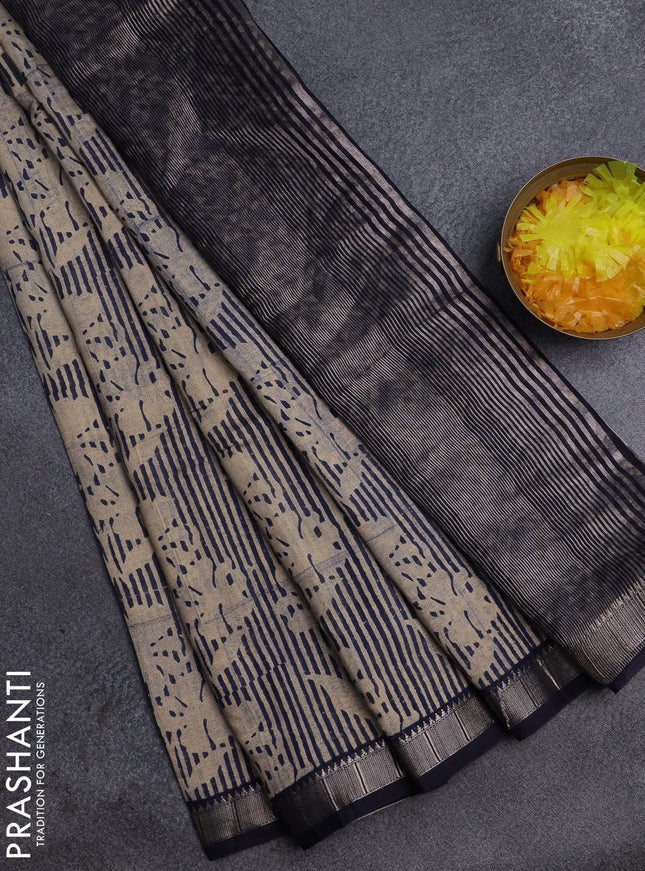 Semi chanderi saree sandal and dark blue with allover floral prints and zari woven border