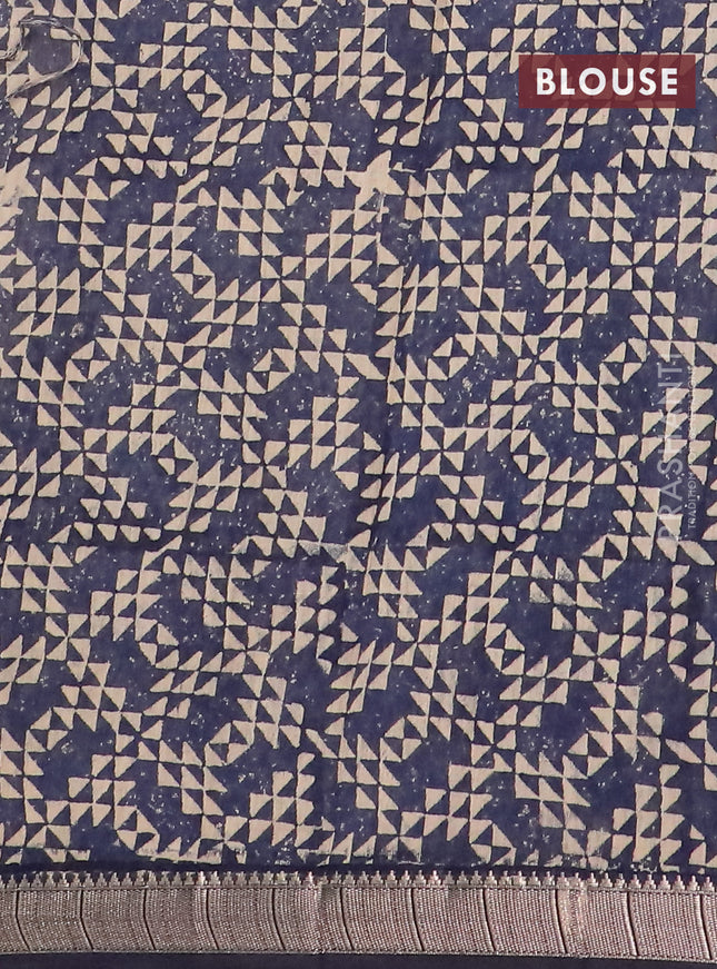 Semi chanderi saree sandal and dark blue with allover floral prints and zari woven border