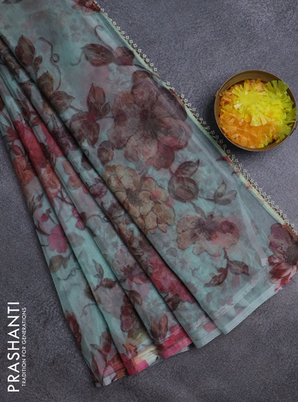 Semi organza saree pastel green with allover floral prints in borderless style