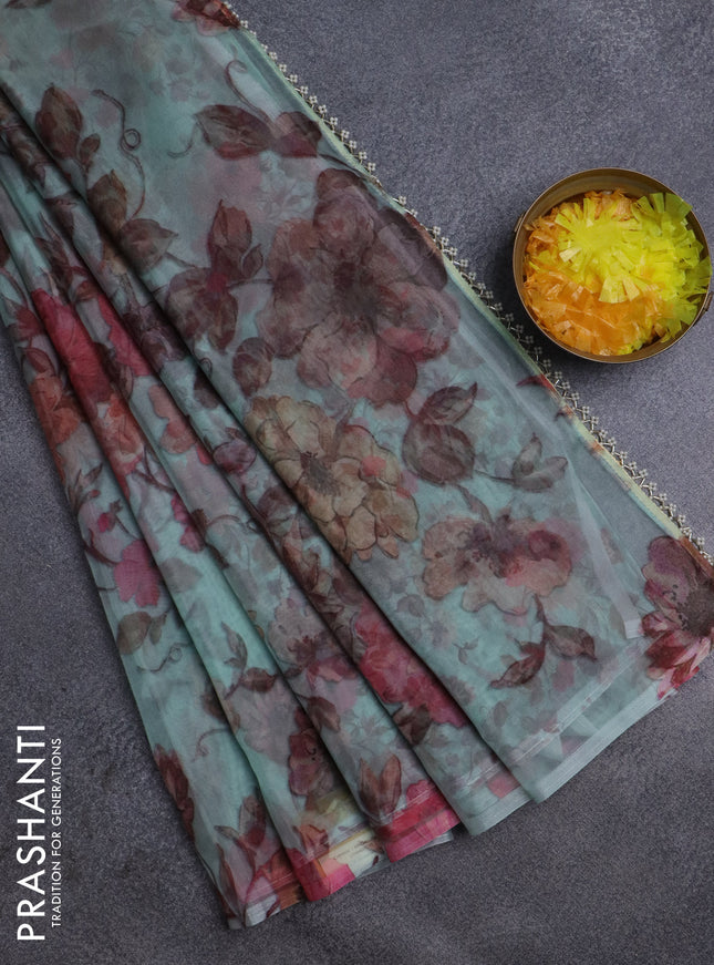 Semi organza saree pastel green with allover floral prints in borderless style