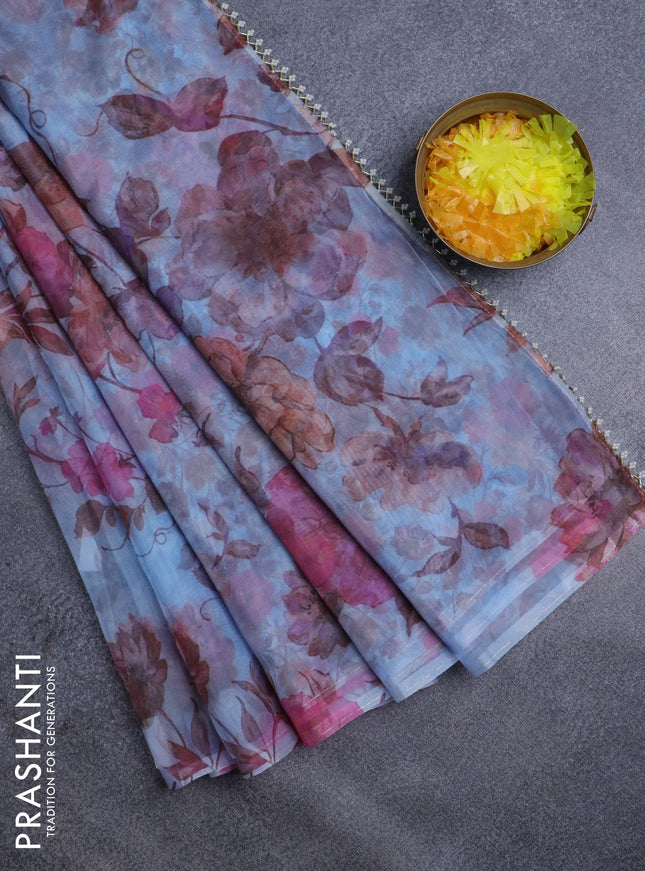 Semi organza saree pastel blue with allover floral prints in borderless style