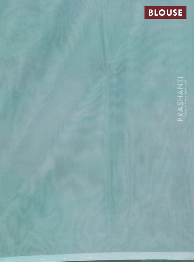 Semi organza saree teal green shade with allover floral prints in borderless style