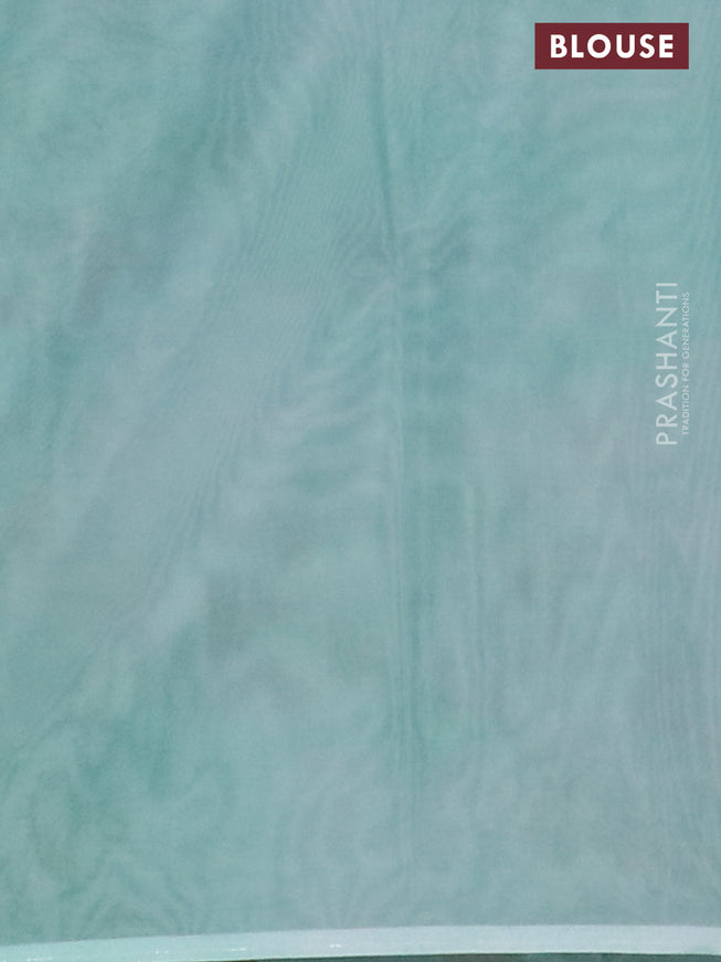 Semi organza saree teal green shade with allover floral prints in borderless style