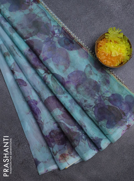 Semi organza saree light blue with allover floral prints in borderless style