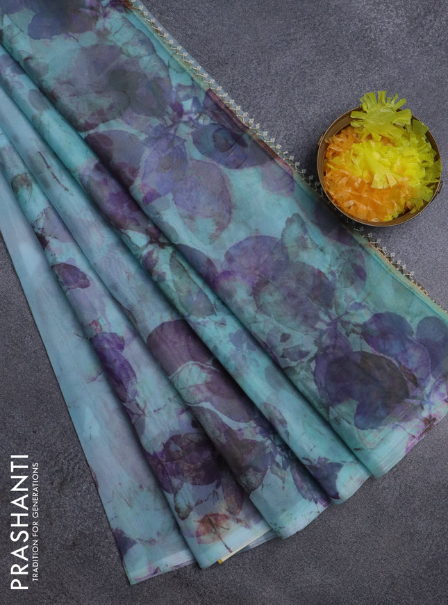 Semi organza saree light blue with allover floral prints in borderless style